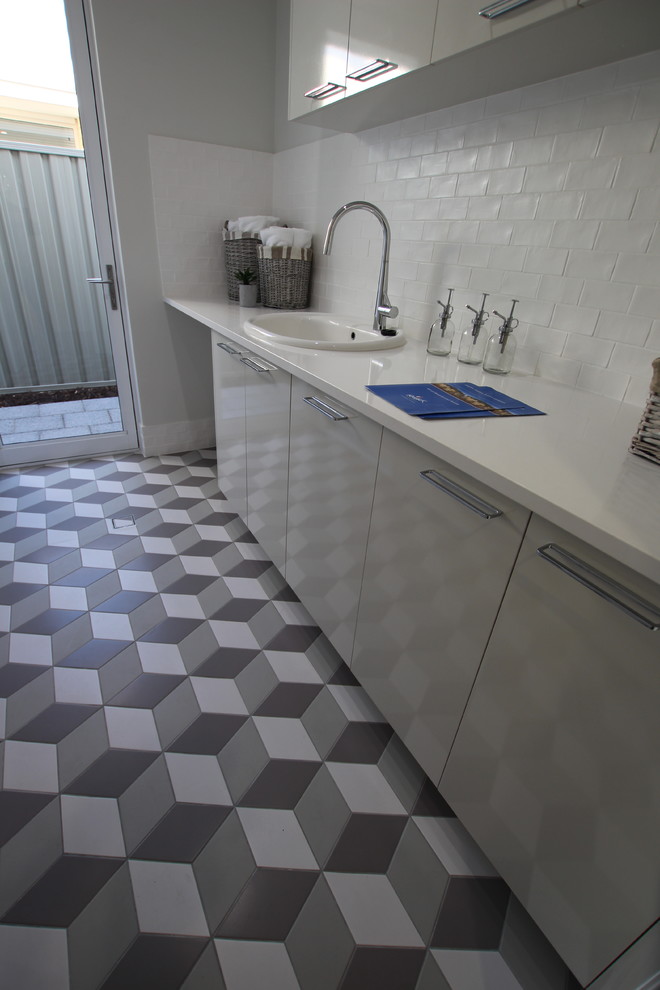 This is an example of a transitional laundry room in Perth.