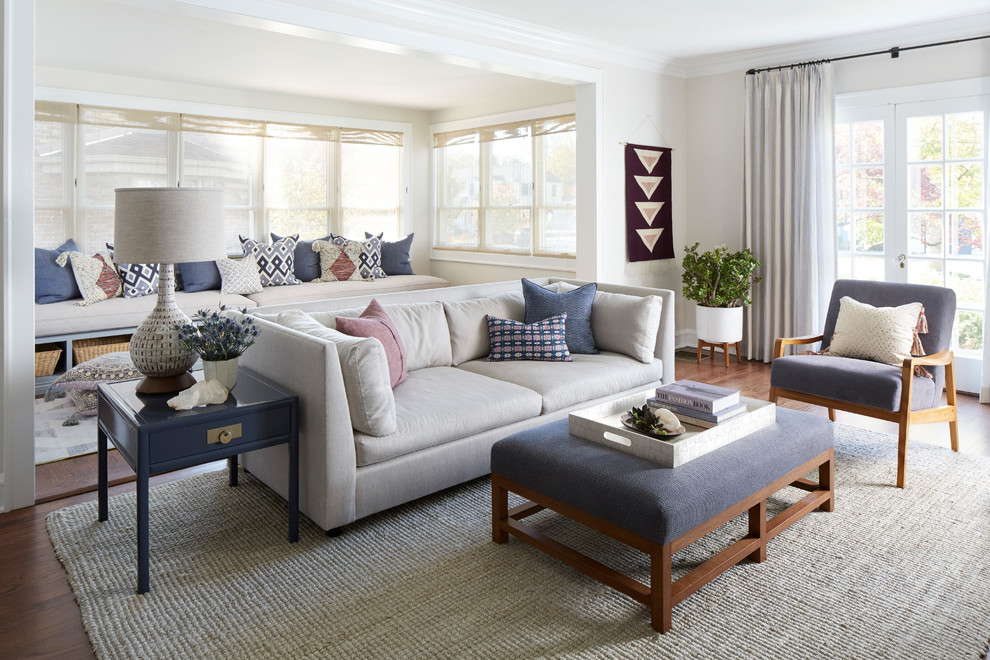 Inspiration for a transitional living room in Chicago with beige walls, medium hardwood floors and brown floor.