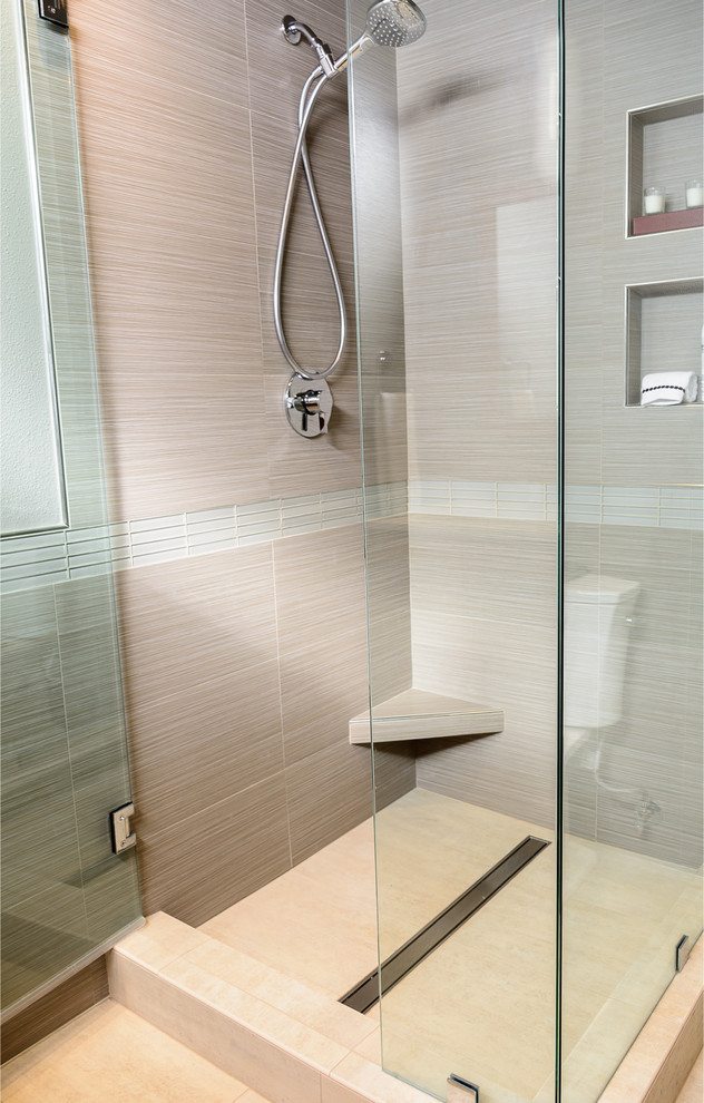 Photo of a large asian master bathroom in Los Angeles with flat-panel cabinets, medium wood cabinets, a corner shower, beige tile, porcelain tile, grey walls, porcelain floors, an undermount sink, quartzite benchtops and a two-piece toilet.
