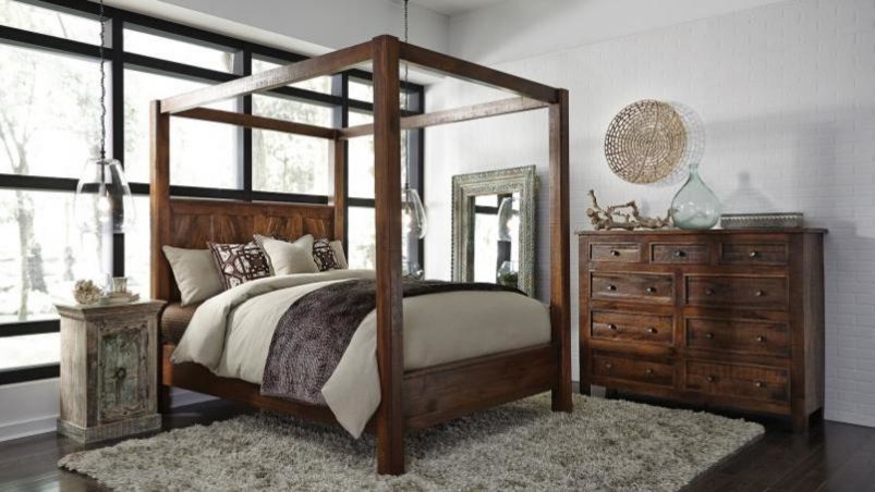 Design ideas for a mid-sized mediterranean master bedroom in San Diego with white walls and dark hardwood floors.