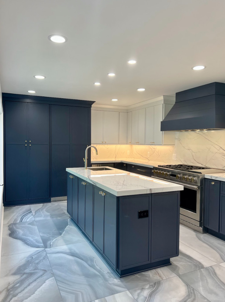 Design ideas for an expansive contemporary single-wall separate kitchen in Detroit with an undermount sink, flat-panel cabinets, granite benchtops, white splashback, granite splashback, panelled appliances, porcelain floors, with island, blue floor, white benchtop and blue cabinets.
