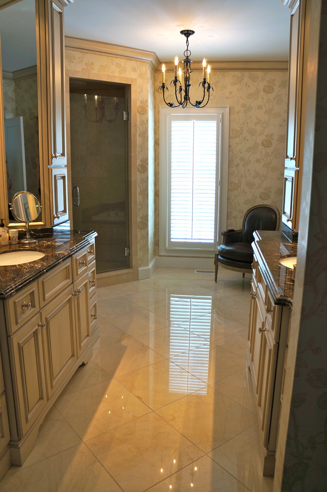 This is an example of a mid-sized traditional master bathroom in Chicago with an undermount sink, recessed-panel cabinets, white cabinets, a freestanding tub, an alcove shower, beige tile and beige walls.