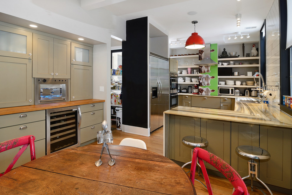 Example of an eclectic u-shaped medium tone wood floor eat-in kitchen design in New York with an undermount sink, open cabinets, white cabinets, white backsplash, subway tile backsplash, stainless steel appliances and white walls