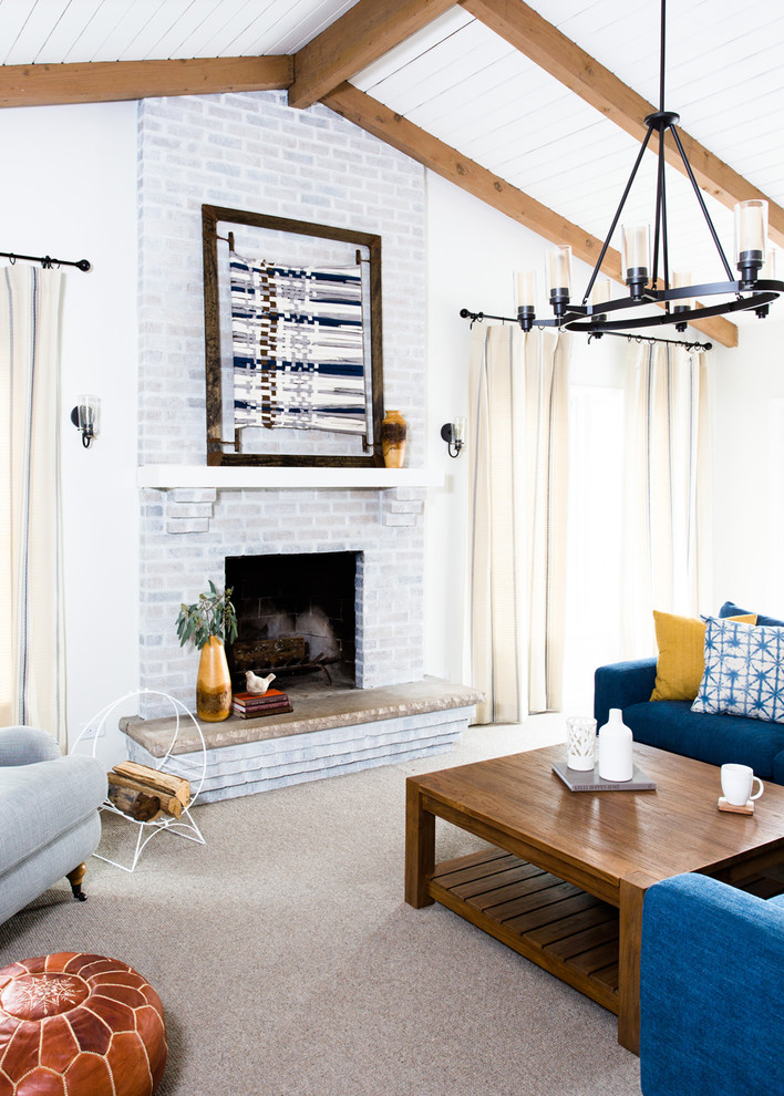 Photo of a mid-sized country family room in Chicago with carpet, a standard fireplace and a brick fireplace surround.