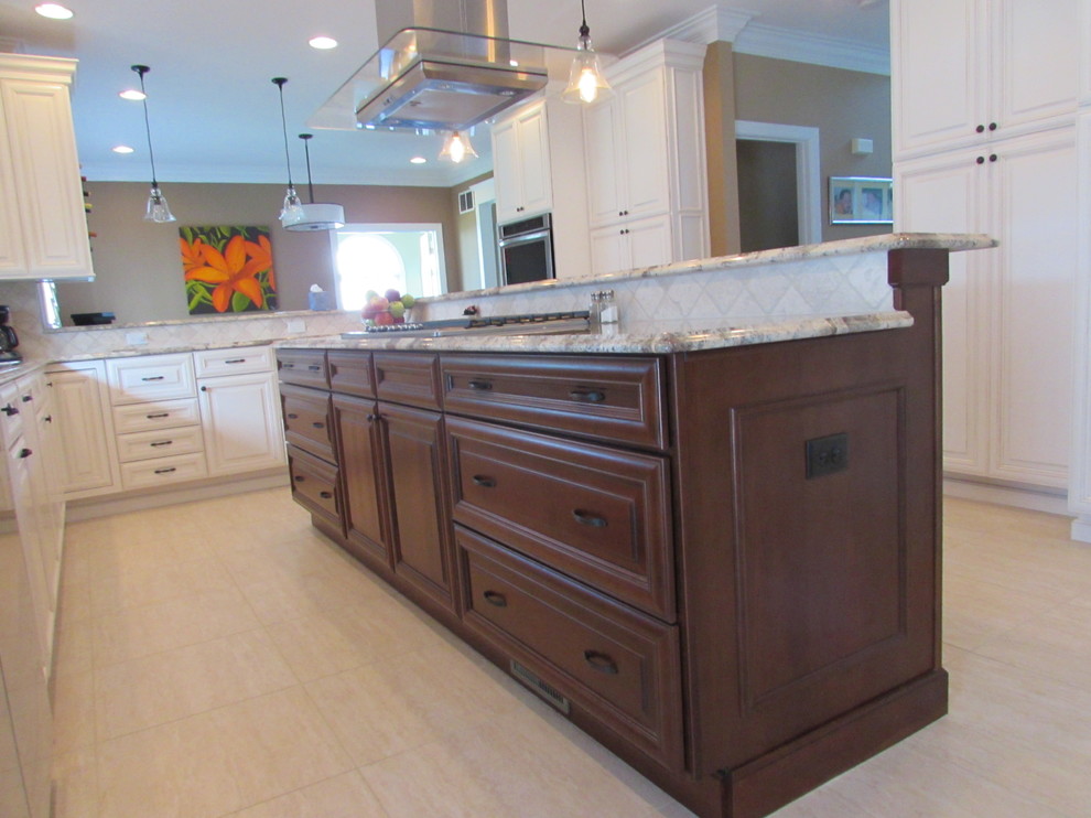 Example of a large transitional l-shaped ceramic tile eat-in kitchen design in Baltimore with an undermount sink, raised-panel cabinets, medium tone wood cabinets, granite countertops, beige backsplash, ceramic backsplash, stainless steel appliances and an island