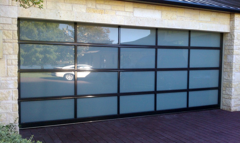 Photo of a large contemporary attached two-car garage in Austin.