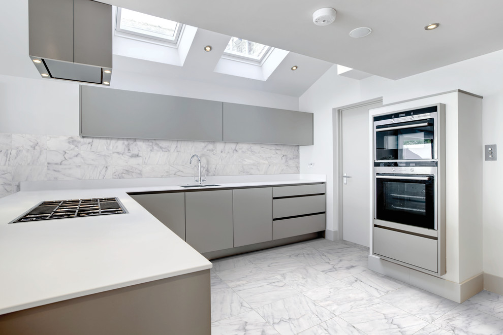 Photo of a large modern l-shaped separate kitchen in Toronto with an undermount sink, flat-panel cabinets, grey cabinets, quartz benchtops, multi-coloured splashback, stone tile splashback, stainless steel appliances, marble floors and no island.
