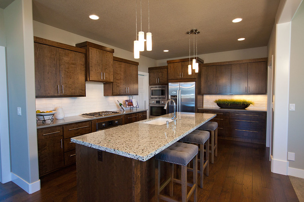 Eat-in kitchen - transitional eat-in kitchen idea in Seattle with flat-panel cabinets and an island