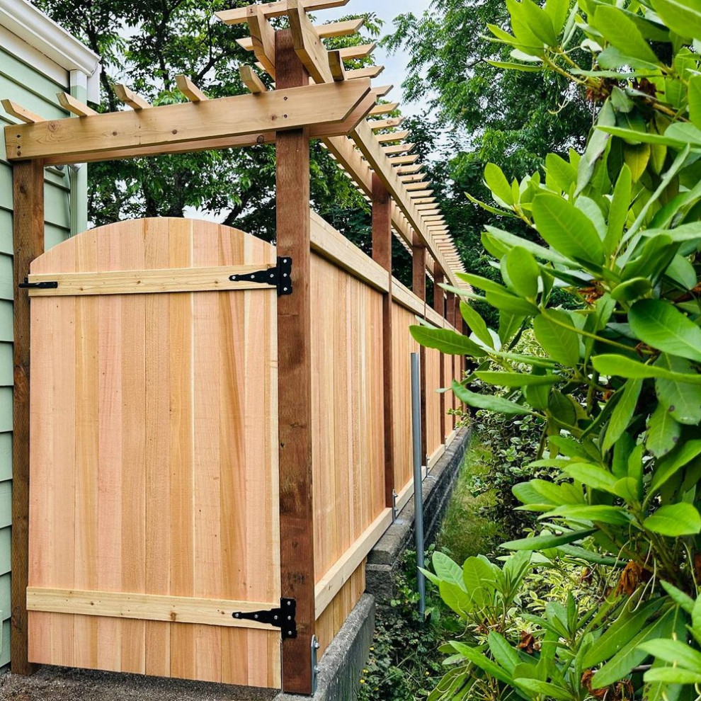 Modern back garden in Seattle with a wood fence.