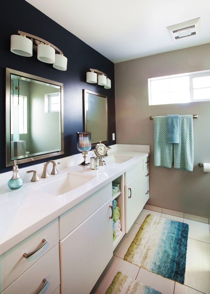 Design ideas for a small transitional master bathroom in Los Angeles with an undermount sink, flat-panel cabinets, white cabinets, engineered quartz benchtops, a corner shower, white tile, porcelain tile, blue walls and porcelain floors.