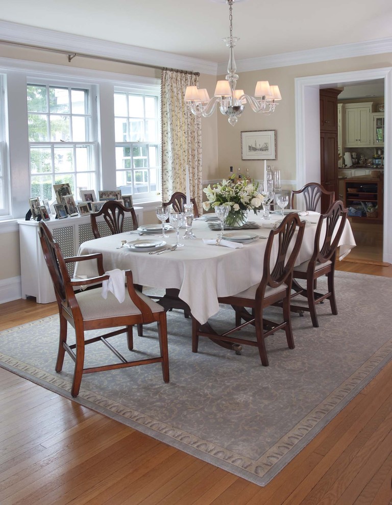 Photo of a traditional dining room in Philadelphia with beige walls and medium hardwood floors.