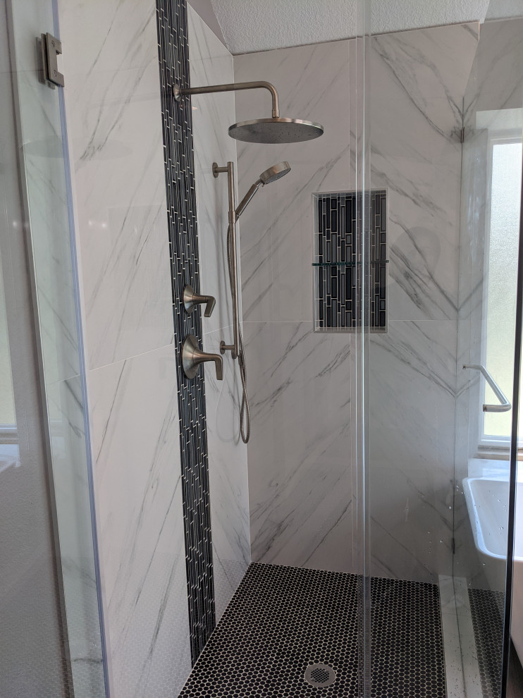 Example of a trendy master white tile and porcelain tile wood-look tile floor and double-sink bathroom design in Houston with shaker cabinets, gray cabinets, a one-piece toilet, an undermount sink, quartz countertops, a hinged shower door, white countertops, a niche and a built-in vanity
