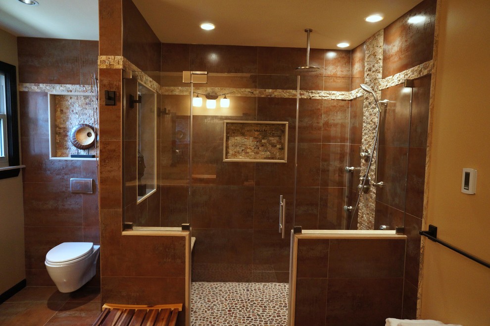 Mid-sized asian master bathroom in Philadelphia with raised-panel cabinets, black cabinets, an alcove shower, a wall-mount toilet, brown walls, slate floors, a vessel sink and limestone benchtops.
