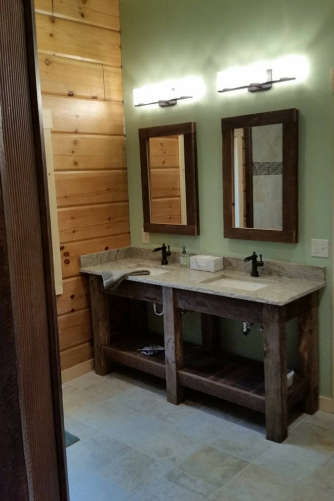 This is an example of a mid-sized country master bathroom in Philadelphia with distressed cabinets, granite benchtops, an open shower, beige tile, ceramic tile and ceramic floors.