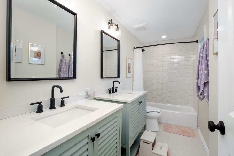 Inspiration for a mid-sized transitional kids bathroom in St Louis with louvered cabinets, green cabinets, an alcove tub, an alcove shower, a two-piece toilet, beige tile, ceramic tile, beige walls, porcelain floors, an undermount sink, engineered quartz benchtops, white floor, a shower curtain, white benchtops, a double vanity and a freestanding vanity.