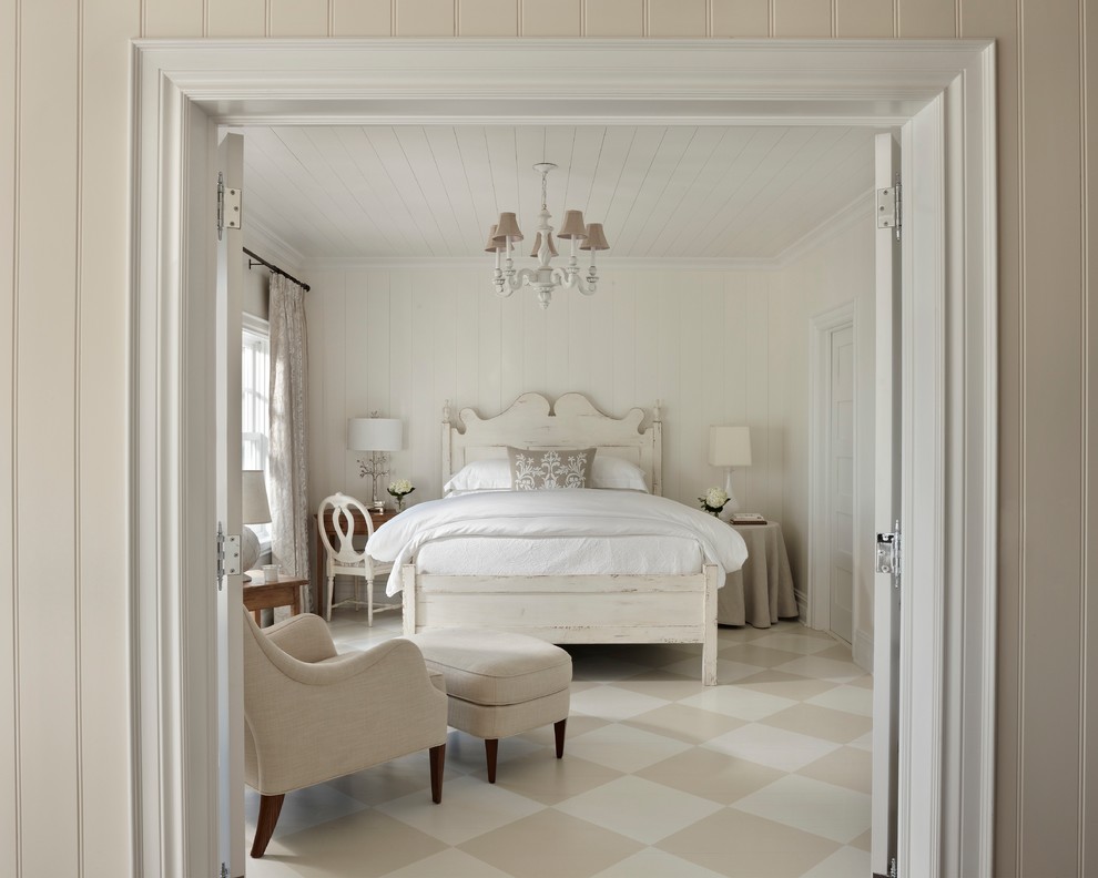 This is an example of a mid-sized beach style guest bedroom in Other with white walls, no fireplace and multi-coloured floor.
