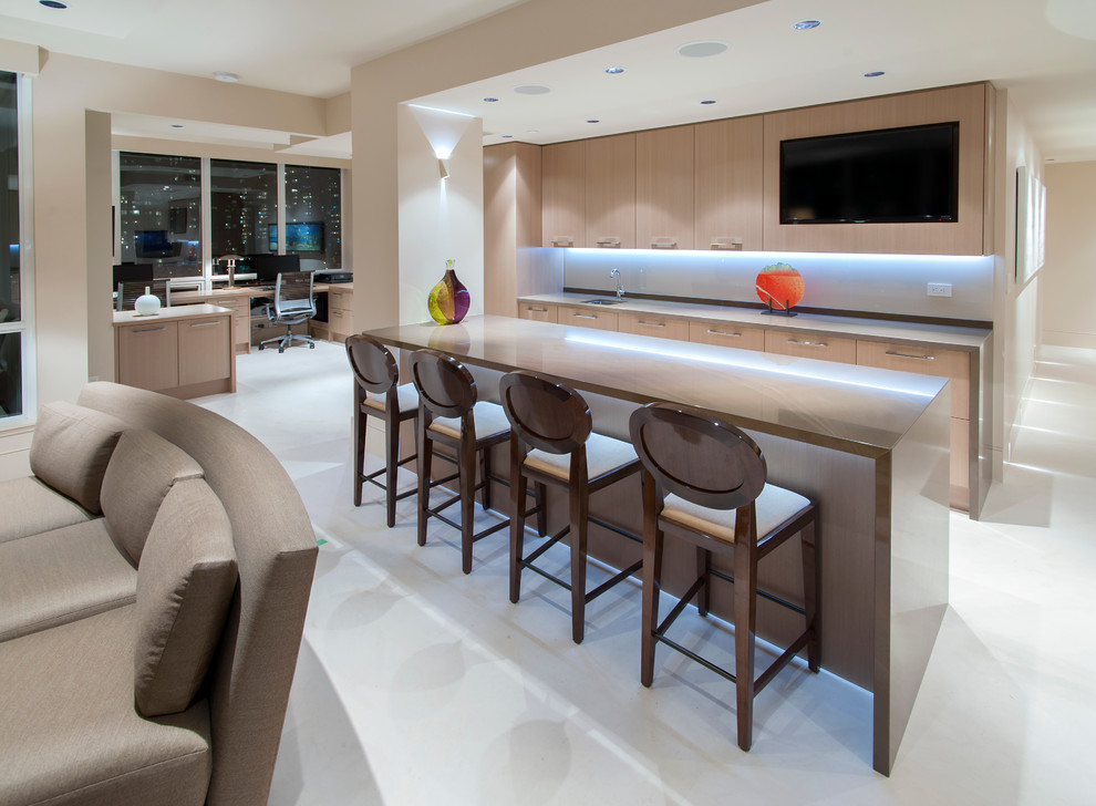 Inspiration for a mid-sized contemporary galley seated home bar in Vancouver with flat-panel cabinets and light wood cabinets.