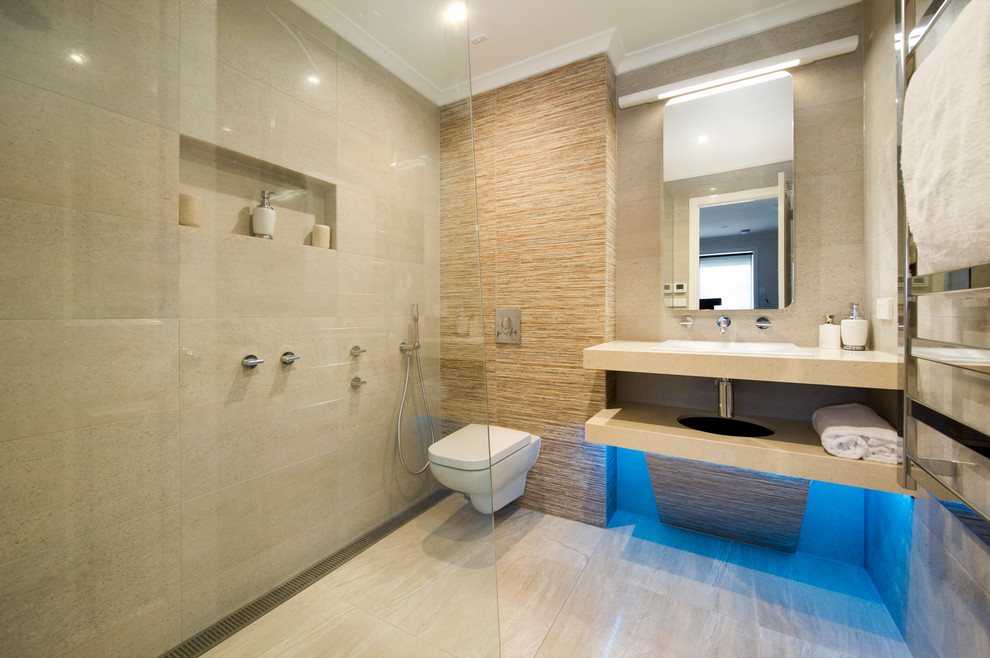 Design ideas for a small modern bathroom in Melbourne with an open shower, a wall-mount toilet, gray tile, porcelain tile, grey walls and porcelain floors.