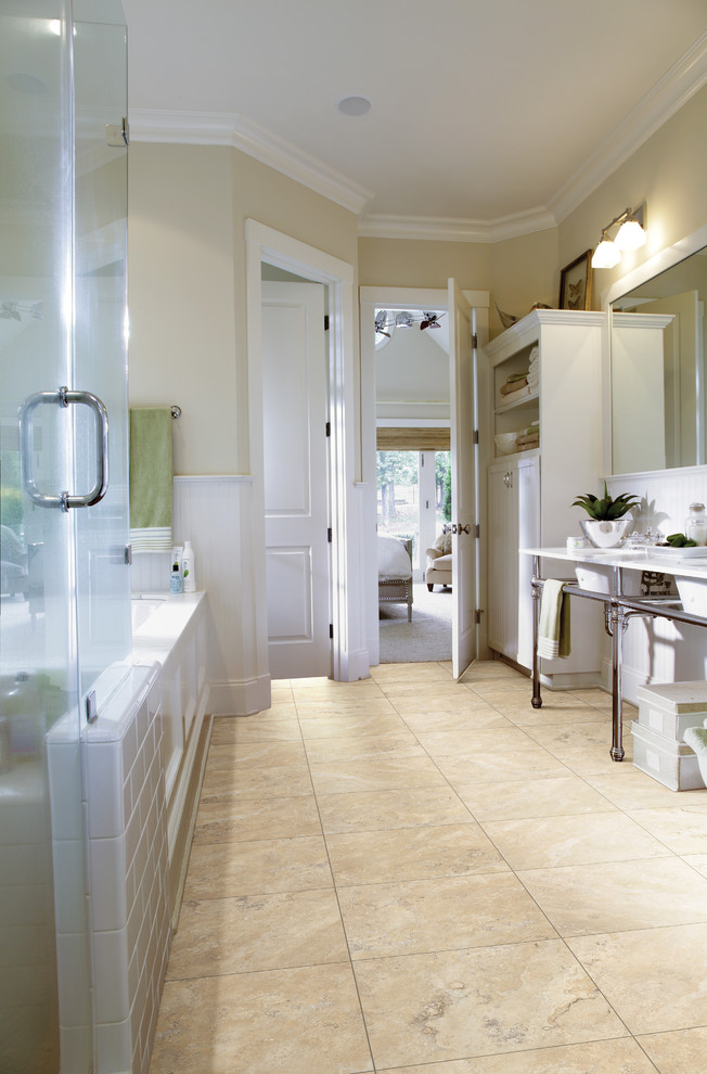 Inspiration for a mid-sized country bathroom in Austin with shaker cabinets, white cabinets, an undermount tub, an alcove shower, white walls, vinyl floors and a pedestal sink.