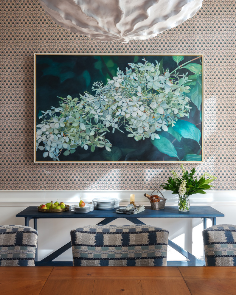 Mid-sized elegant light wood floor, brown floor and wallpaper enclosed dining room photo in Los Angeles with blue walls