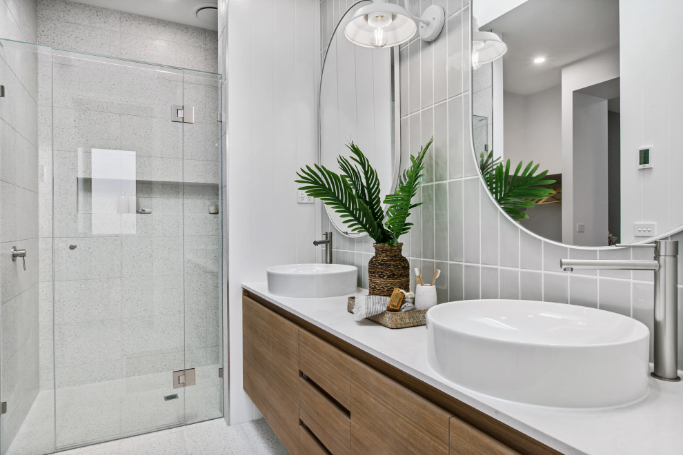 Design ideas for a mid-sized contemporary master bathroom in Melbourne with gray tile, subway tile, a double vanity and a built-in vanity.