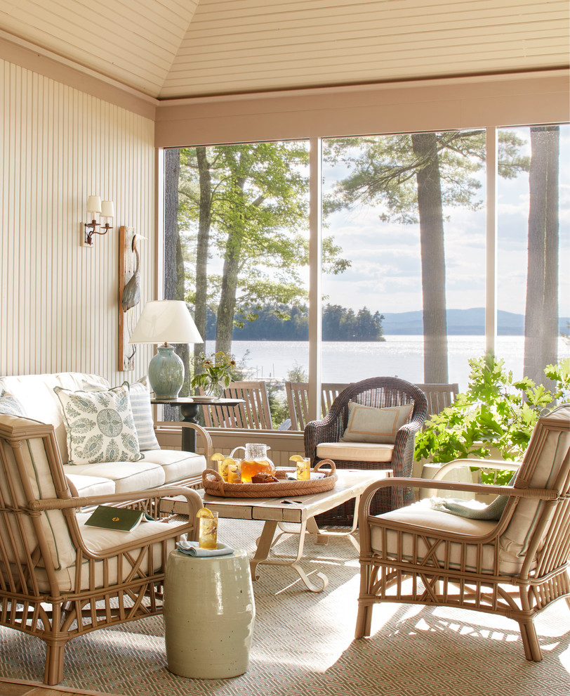 Inspiration for a mid-sized beach style screened-in verandah in Portland Maine with a roof extension.