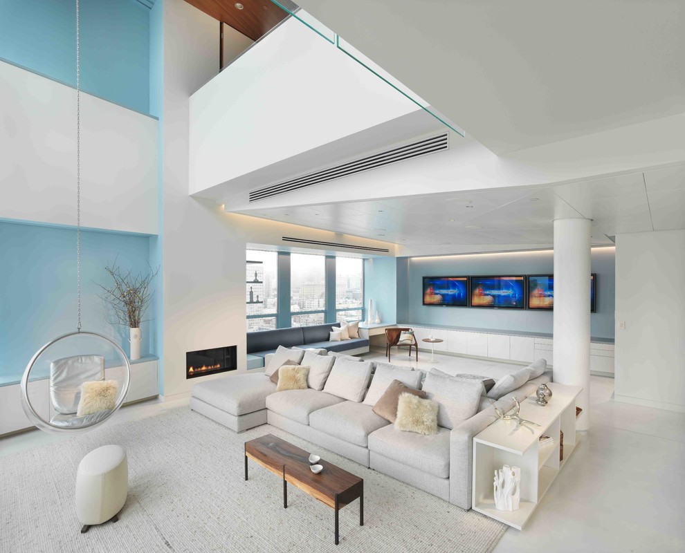 Contemporary open concept living room in San Francisco with blue walls and a ribbon fireplace.