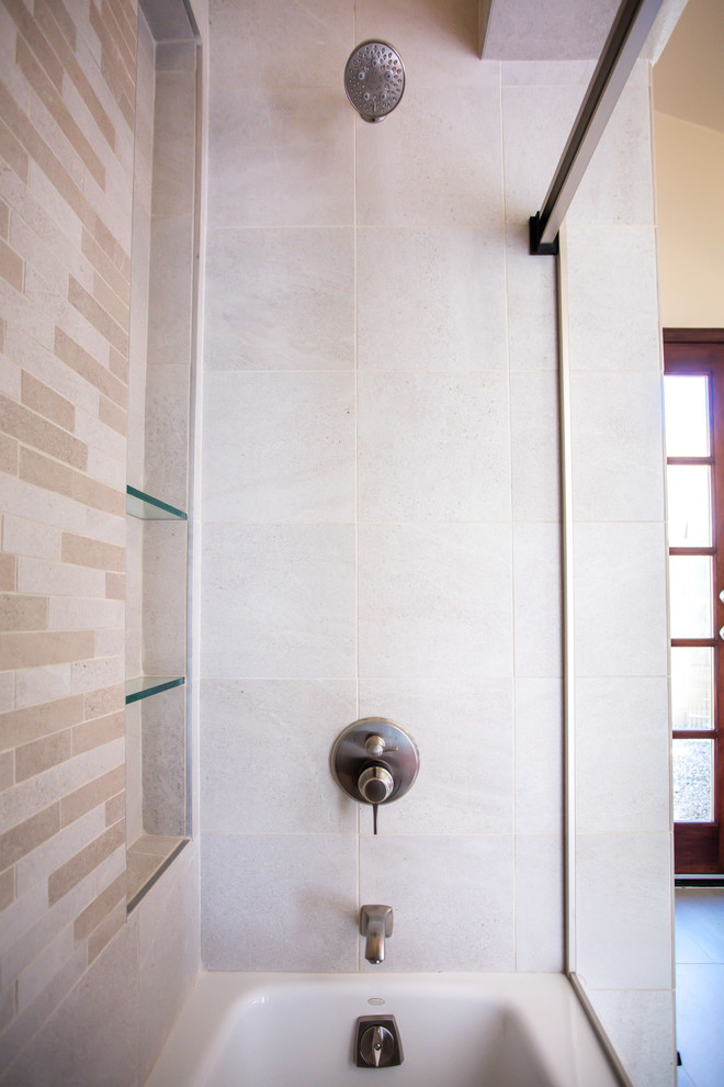 Alcove bathtub - small transitional beige tile and porcelain tile porcelain tile and beige floor alcove bathtub idea in Phoenix with flat-panel cabinets, medium tone wood cabinets, a one-piece toilet, beige walls, a vessel sink and granite countertops