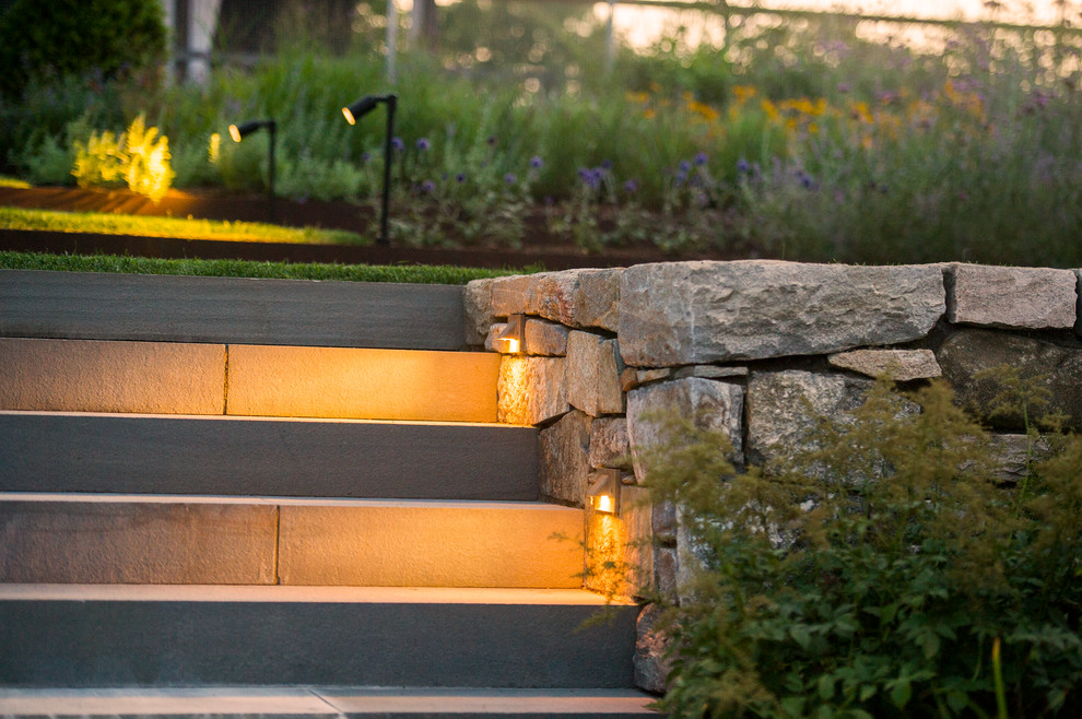 Inspiration for a mid-sized contemporary backyard partial sun garden in New York with concrete pavers.