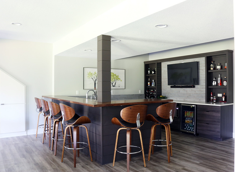 Inspiration for a large midcentury home bar in Other with vinyl floors and grey floor.