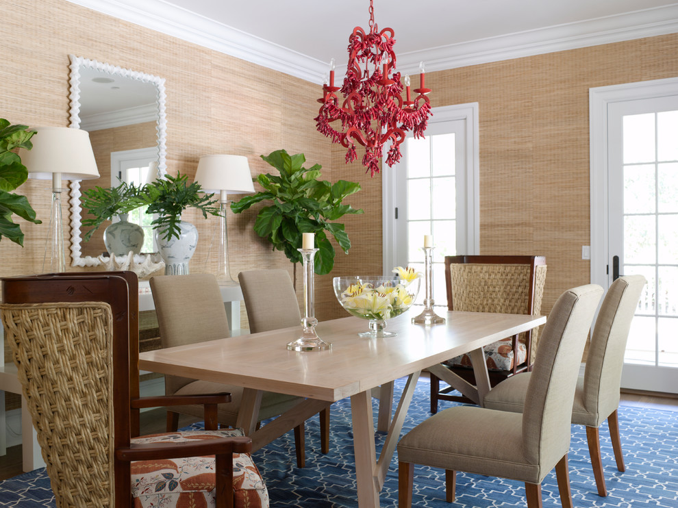 Photo of a tropical dining room in New York with beige walls.
