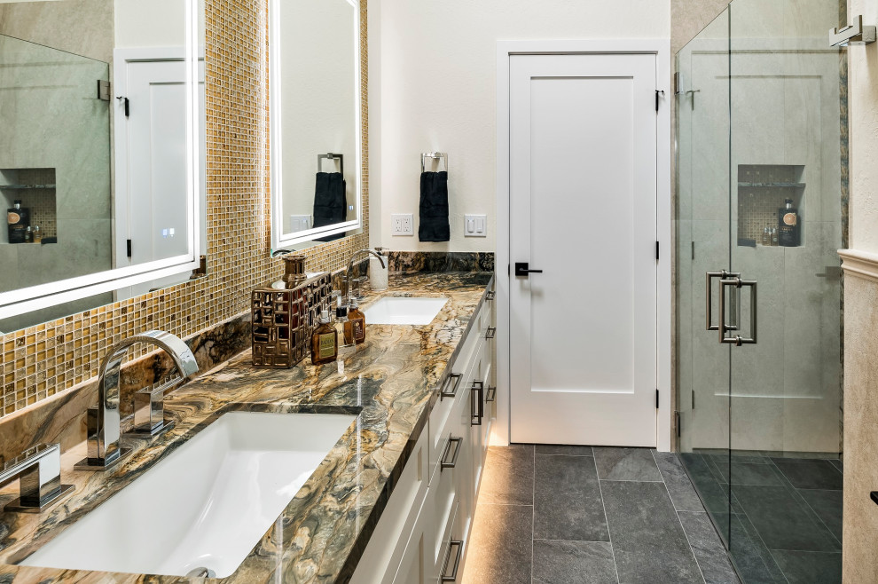 Photo of a mid-sized transitional master bathroom in Other with shaker cabinets, white cabinets, a curbless shower, a bidet, multi-coloured tile, glass tile, beige walls, porcelain floors, an undermount sink, quartzite benchtops, black floor, a hinged shower door, multi-coloured benchtops, a niche, a double vanity, a built-in vanity and exposed beam.