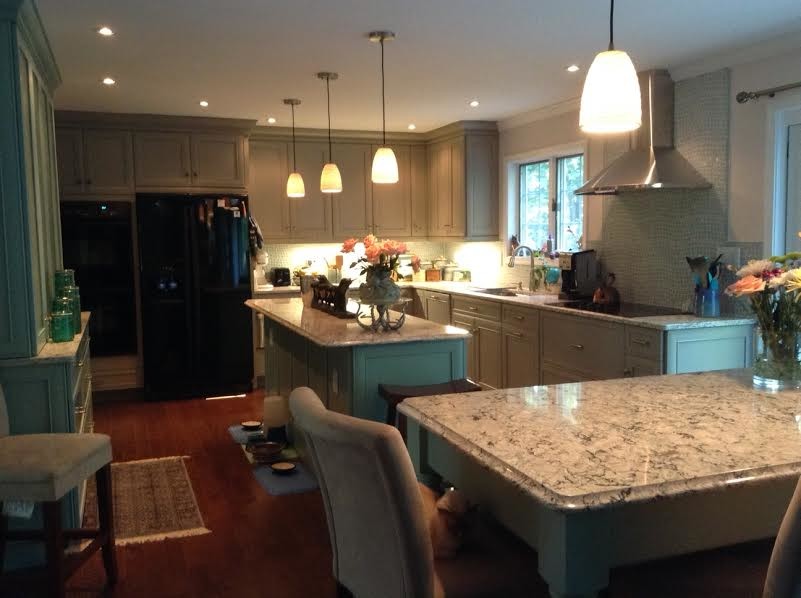 Large transitional l-shaped dark wood floor eat-in kitchen photo in Baltimore with a double-bowl sink, recessed-panel cabinets, dark wood cabinets, marble countertops, gray backsplash, glass sheet backsplash, stainless steel appliances and an island