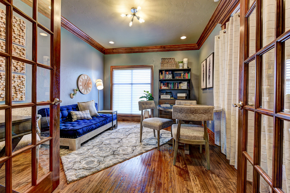 This is an example of a mid-sized modern gender-neutral kids' room in Oklahoma City with grey walls and medium hardwood floors.