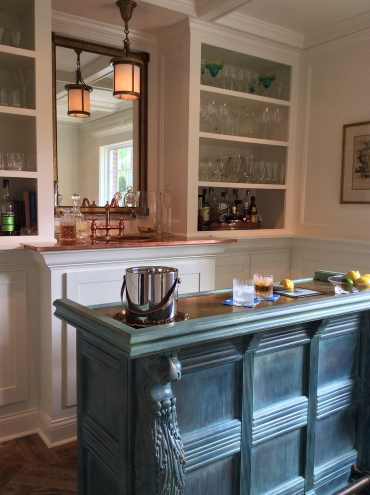 This is an example of a large transitional galley home bar in Indianapolis with a drop-in sink, recessed-panel cabinets, blue cabinets, wood benchtops, white splashback and dark hardwood floors.