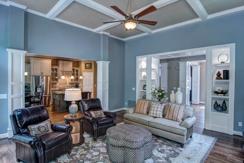 Photo of a mid-sized traditional living room in Atlanta with blue walls and medium hardwood floors.