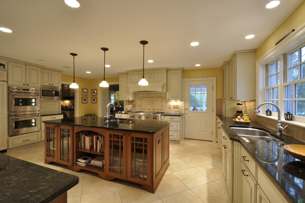 Example of a huge transitional ceramic tile open concept kitchen design in DC Metro with a double-bowl sink, raised-panel cabinets, white cabinets, stainless steel appliances and two islands