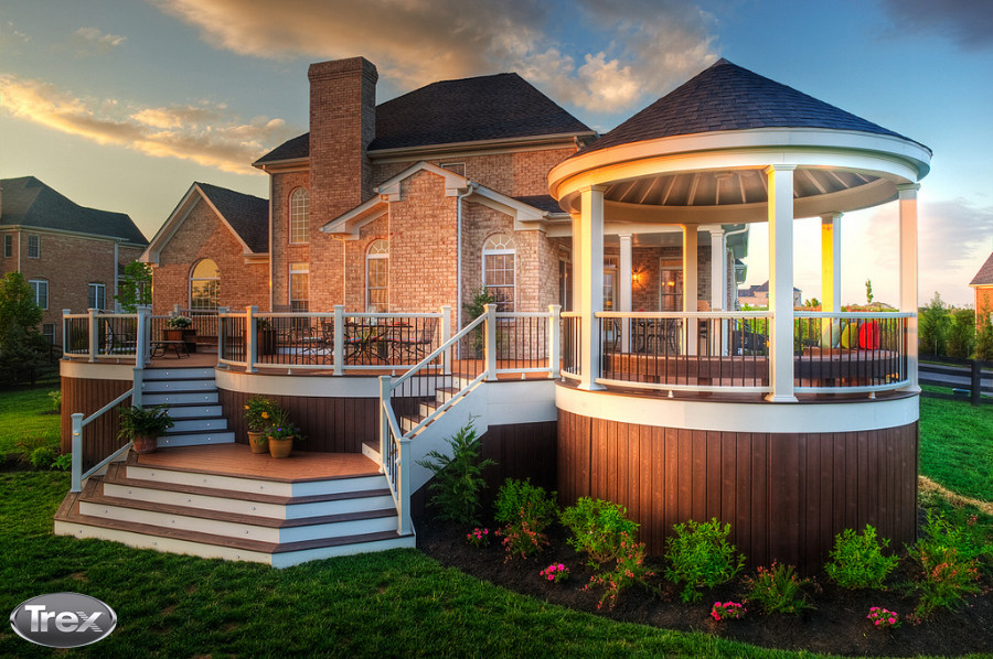 Inspiration for a large backyard deck remodel with a pergola