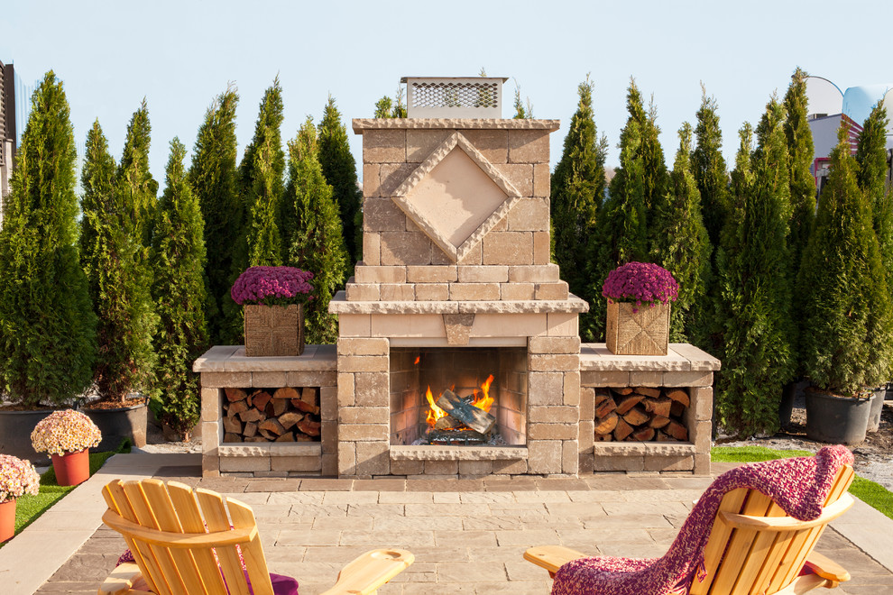 Mid-sized mountain style backyard patio photo with a fire pit