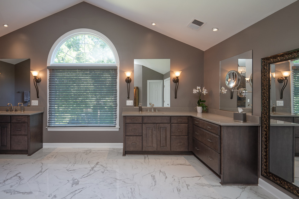 Inspiration for a large contemporary master bathroom in DC Metro with raised-panel cabinets, dark wood cabinets, grey walls, marble floors, an undermount sink, solid surface benchtops, white floor and grey benchtops.