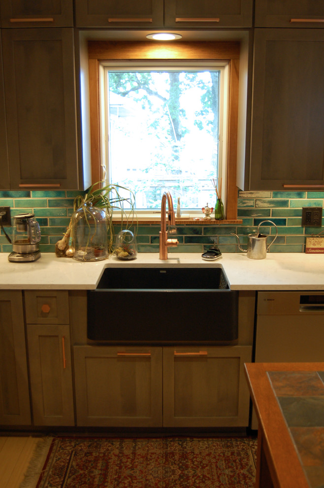 Example of a transitional l-shaped light wood floor and multicolored floor open concept kitchen design with a farmhouse sink, shaker cabinets, gray cabinets, quartzite countertops, blue backsplash, ceramic backsplash, stainless steel appliances and an island