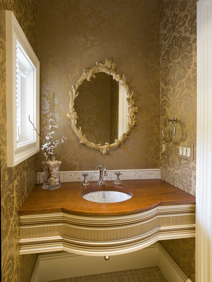 Small eclectic powder room in Other with an undermount sink, a one-piece toilet and ceramic floors.