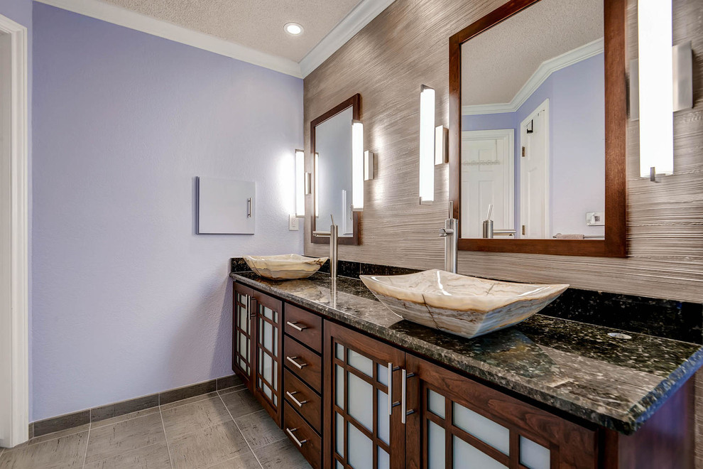 Large asian master bathroom in Denver with a vessel sink, shaker cabinets, medium wood cabinets, granite benchtops, a corner shower, a two-piece toilet, gray tile, ceramic tile, purple walls and ceramic floors.