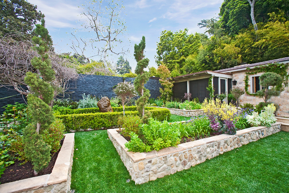 Design ideas for a mediterranean backyard garden in Los Angeles.
