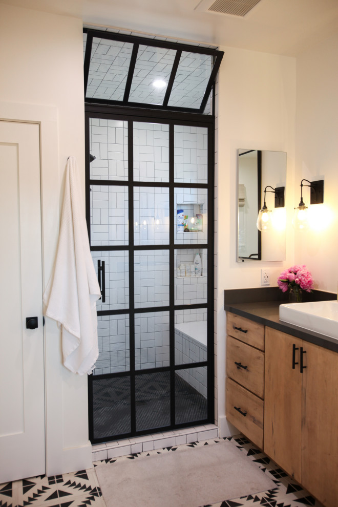 Example of a transitional master bathroom design in Los Angeles