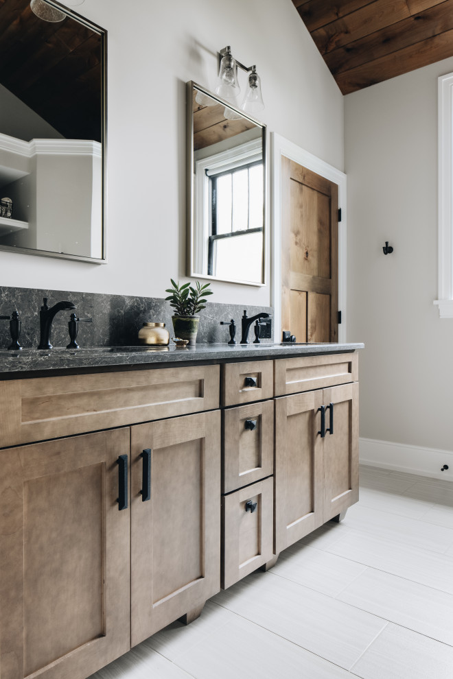 Inspiration for a mid-sized rustic master porcelain tile, gray floor, double-sink and wood ceiling bathroom remodel in Grand Rapids with shaker cabinets, beige walls, an undermount sink, quartz countertops, a built-in vanity, medium tone wood cabinets and gray countertops