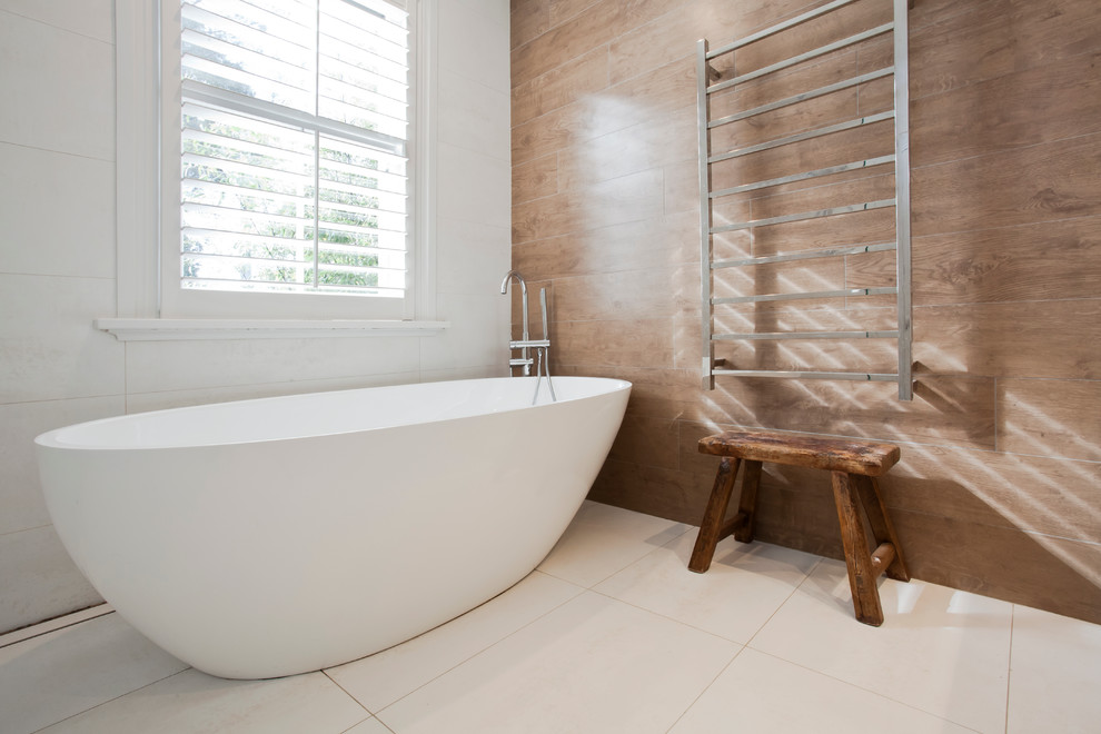 Design ideas for a large traditional master bathroom in Sydney with a freestanding tub, beige tile, ceramic tile, white walls, ceramic floors, a vessel sink and white floor.