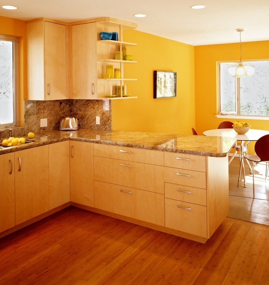Photo of a mid-sized contemporary u-shaped eat-in kitchen in San Francisco with a double-bowl sink, flat-panel cabinets, light wood cabinets, granite benchtops, multi-coloured splashback, stone slab splashback, stainless steel appliances, no island, beige floor and light hardwood floors.