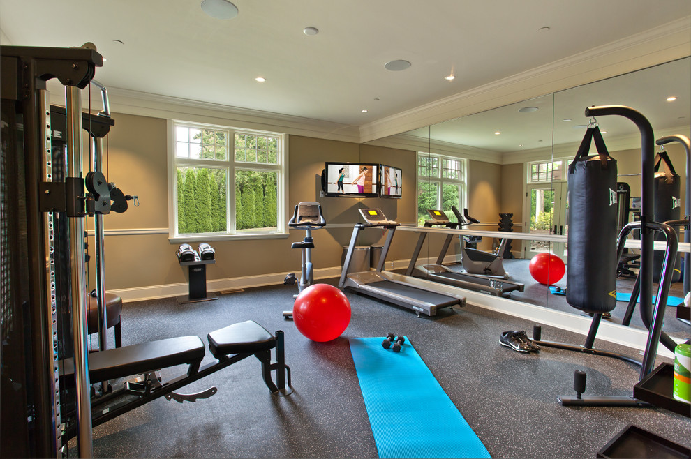 This is an example of a small traditional home weight room in Seattle with brown walls.