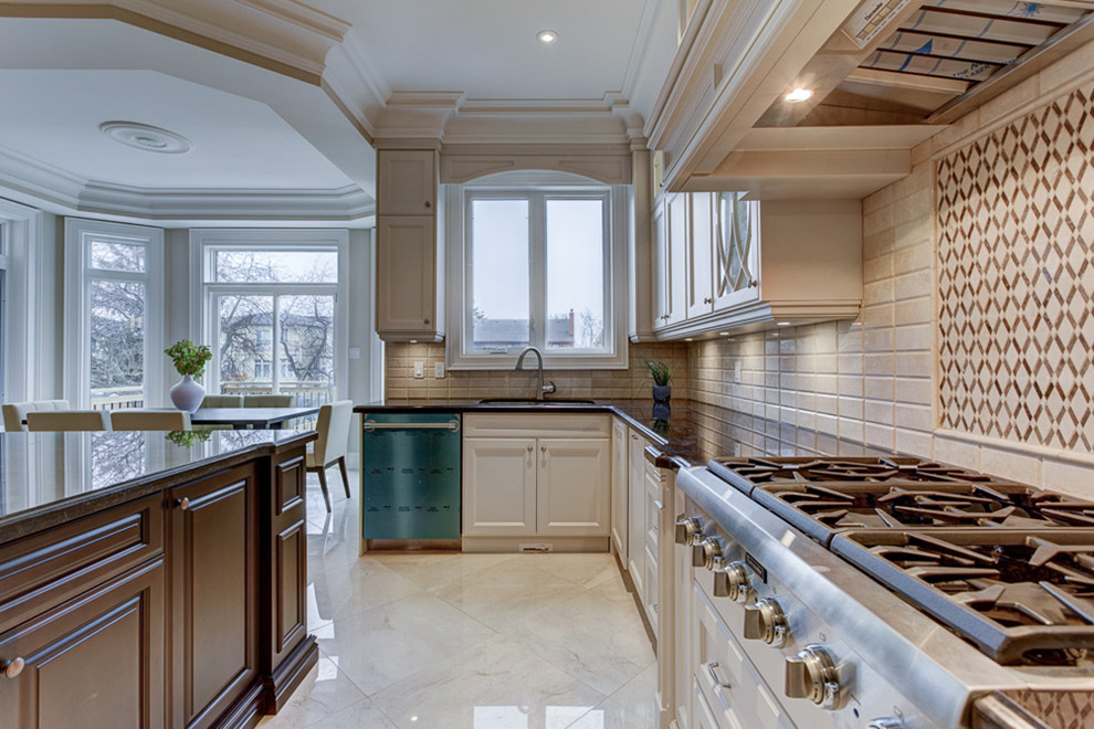Example of a transitional kitchen design in Toronto
